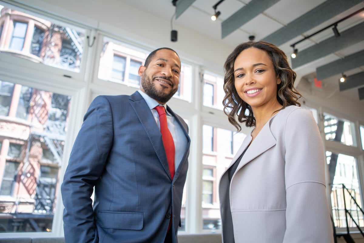 man-and-woman-smiling-inside-building-1367269